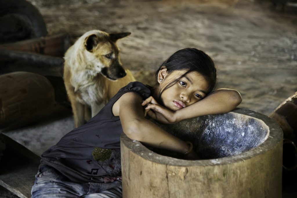 DSC_4040, Lavazza, Vietnam, 2013, VIETNAM-10087. A girl with a dog resting. MAX PRINT SIZE: 40x60 Coffee_Book retouched_Sonny Fabbri 10/15/2014 From These Hands. A Journey Along the Coffee Trail. Phaidon Press Limited.