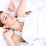 Young beautiful woman sleeping in bed close-up