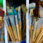 Paint brushes on window sil